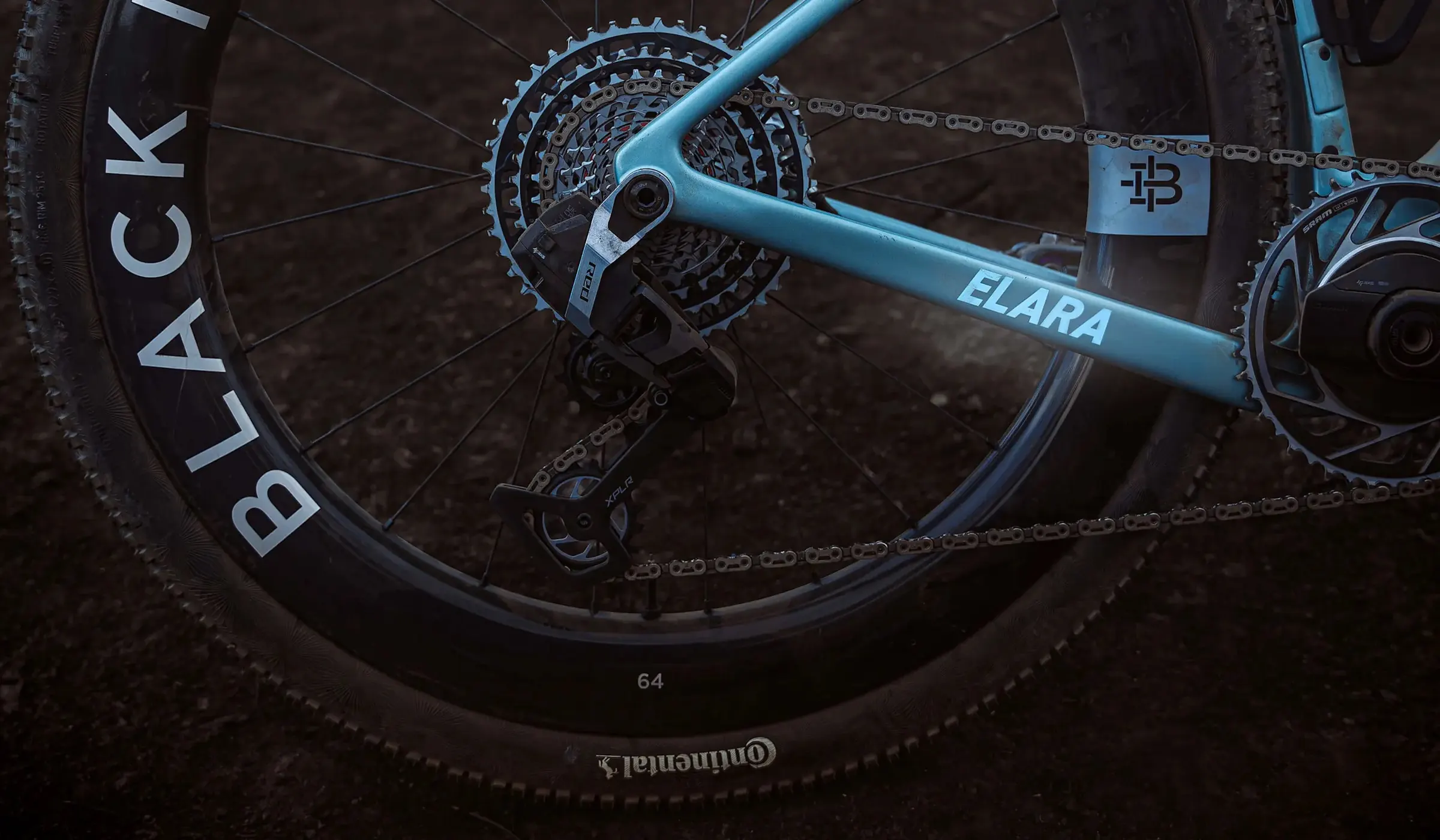 Close-up of a Factor Elara drivetrain with a SRAM XPLR rear derailleur and Black Inc wheel